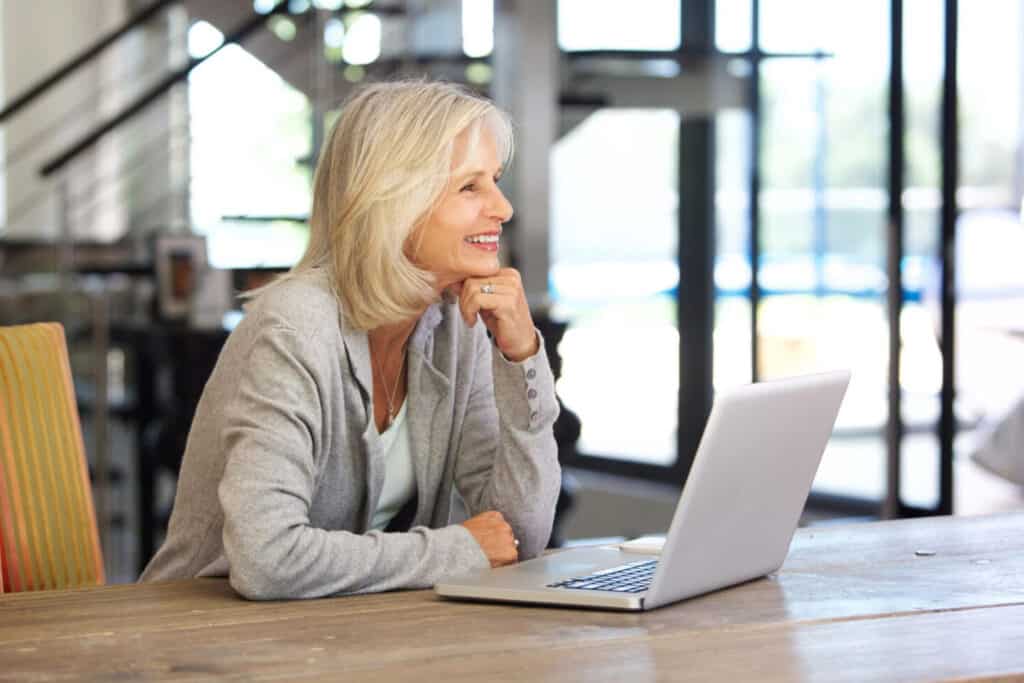 Older woman on laptop scaled2