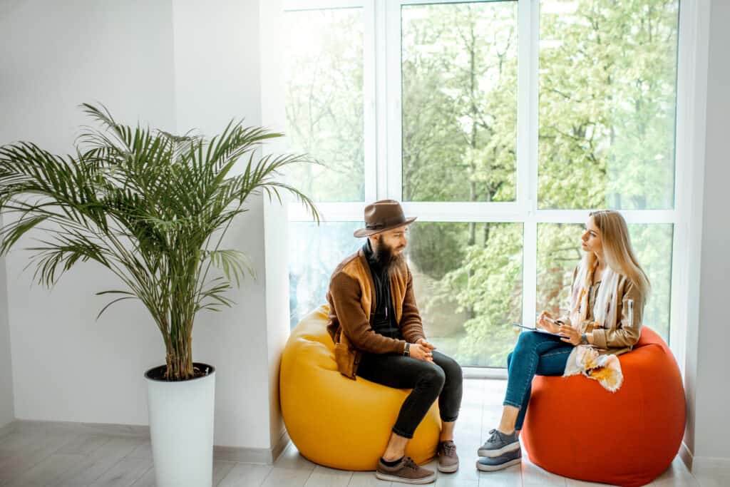 man and woman during the psychological counseling indoors