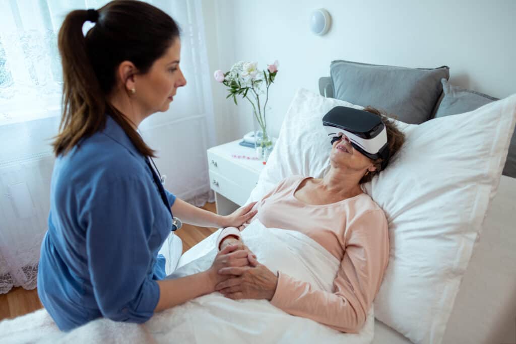senior female patient relaxing in hospital bed with virtual reality headset